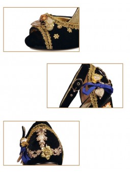 Black velvet sandals with a high block heel, featuring strap closure with a buckle. Gold leather insole