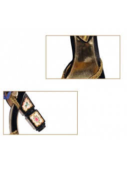 Black velvet sandals with a high block heel, featuring strap closure with a buckle. Gold leather insole