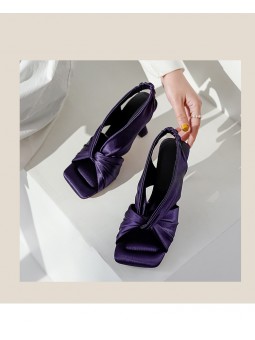 Purple satin square-toe high-heel mules featuring an elasticated back strap and leather insole.