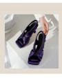 Purple satin square-toe high-heel mules featuring an elasticated back strap and leather insole.