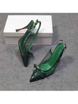 Green leather slingback pumps with stiletto heels, featuring a pointed toe with a bow and a gold-tone metal buckle