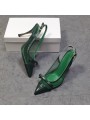 Green leather slingback pumps with stiletto heels, featuring a pointed toe with a bow and a gold-tone metal buckle