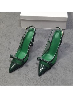 Green leather slingback pumps with stiletto heels, featuring a pointed toe with a bow and a gold-tone metal buckle