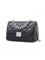 Black quilted leather shoulder bag adorned with a silver gourmet chain. Elegance and modernity in one accessory.