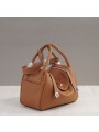 Warm and authentic, this caramel leather bag is the essence of natural chic.