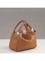 Warm and authentic, this caramel leather bag is the essence of natural chic.