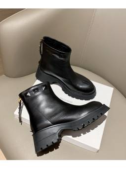 Black leather ankle boots with thick platform, combining style and comfort