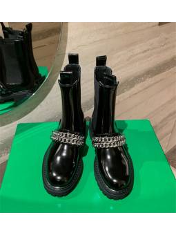 Black patent leather Chelsea boots with double chains