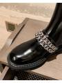 Black patent leather Chelsea boots with double chains