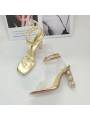 Gold stiletto-heeled lace-up sandals for women, adorned with sparkling crystals