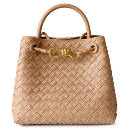 Women's woven leather shoulder bag in nude color with a gold logo.