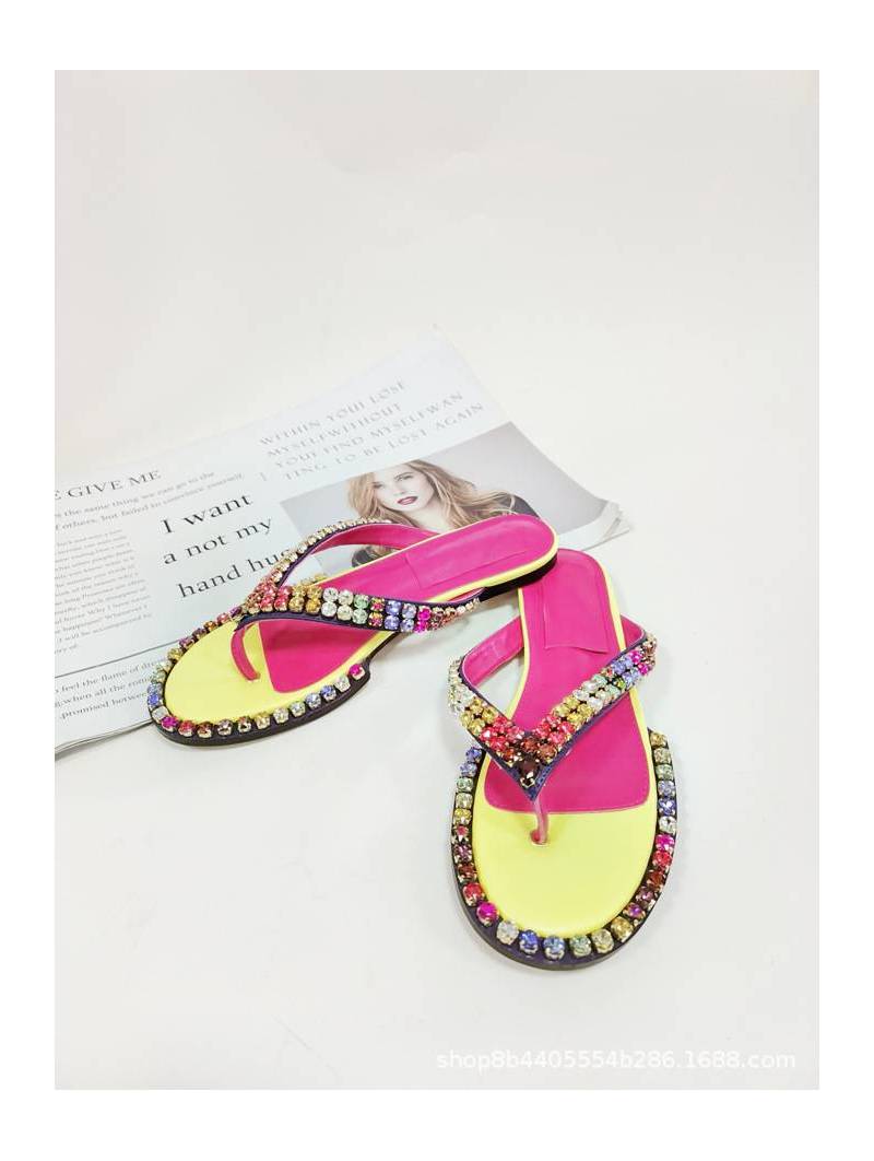 Women's multicolored flip-flops adorned with sparkling crystals, featuring a flat sole and genuine leather insole