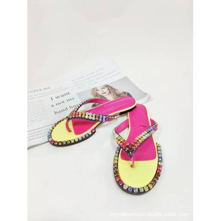 Women's multicolored flip-flops adorned with sparkling crystals, featuring a flat sole and genuine leather insole