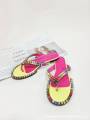 Women's multicolored flip-flops adorned with sparkling crystals, featuring a flat sole and genuine leather insole