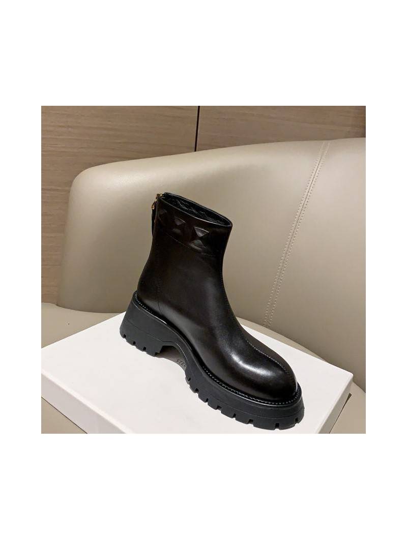 Black leather ankle boots with thick platform, combining style and comfort