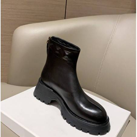 Black leather ankle boots with thick platform, combining style and comfort