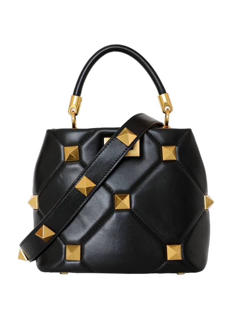 Black quilted studded leather handbag with sliding chain and protective feet. Gold finish for a refined look.