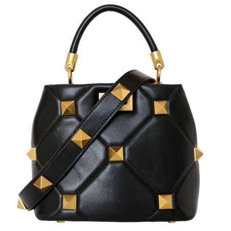 Black quilted studded leather handbag with sliding chain and protective feet. Gold finish for a refined look.