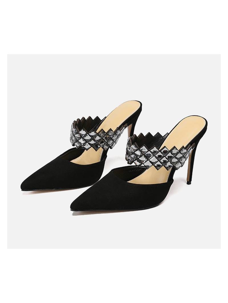 Elegant black suede high-heeled sandals with a strap adorned with rhinestones for a glamorous touch.