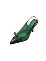 Green leather slingback pumps with stiletto heels, featuring a pointed toe with a bow and a gold-tone metal buckle